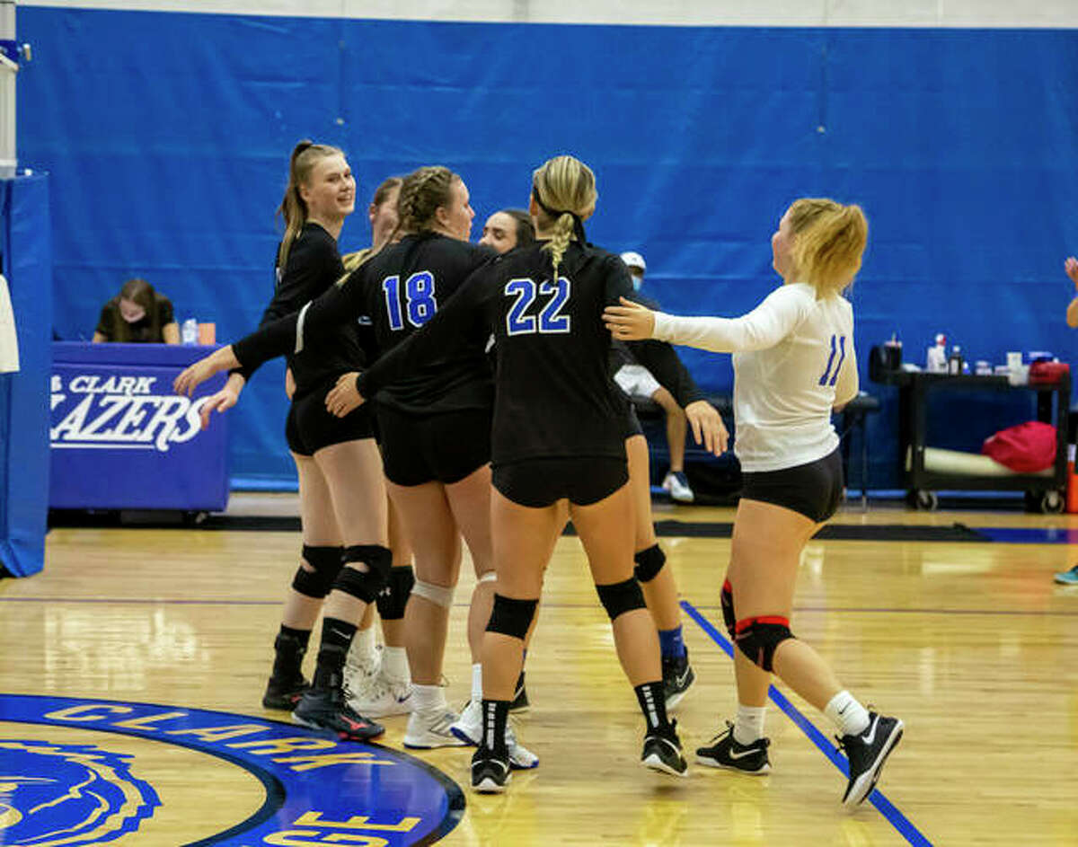Members of the Lewis and Clark Community College volleyball team celebrate during action earlier this season at the River Bend Arena.