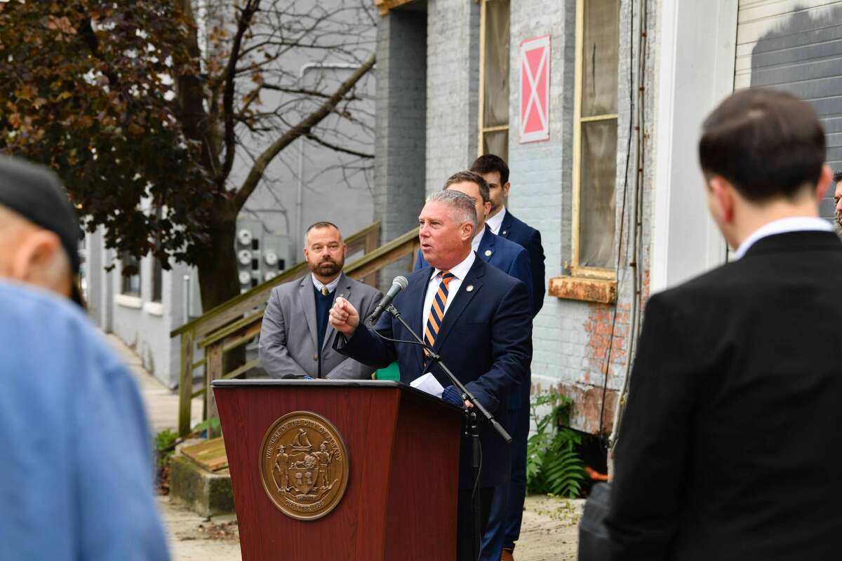 Assemblyman John McDonald speaks on Sheridan Street in Albany about a change to state code enforcement. 