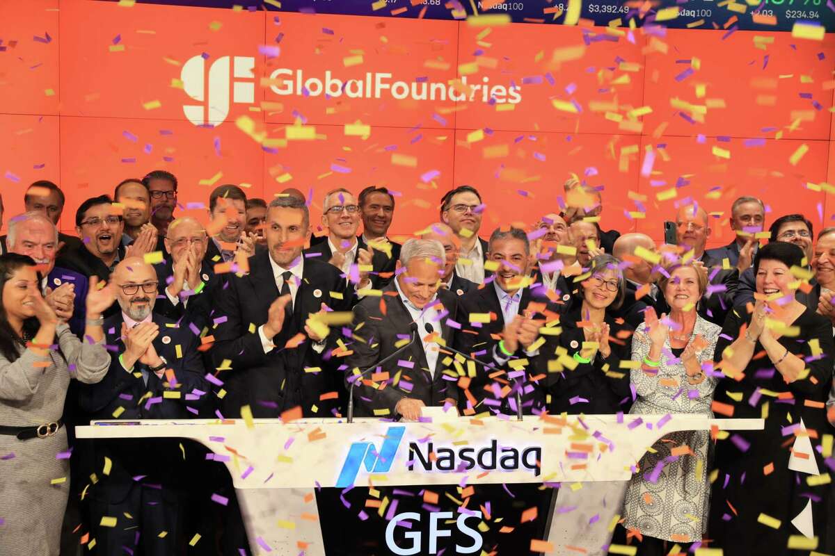 GlobalFoundries CEO Tom Caulfield, front center, basks in confetti with employees and other supporters after the company's initial public offering on Thursday, Oct. 28, 2021 at the Nasdaq stock market in New York City. The company's stock is up 40 percent since.