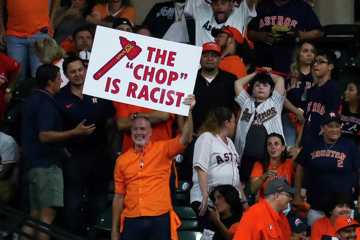 A fan holds a sign referencing the Braves’ “chop” chant during the ninth inning of Game 1 of the World Series on Tuesday at Minute Maid Park in Houston.