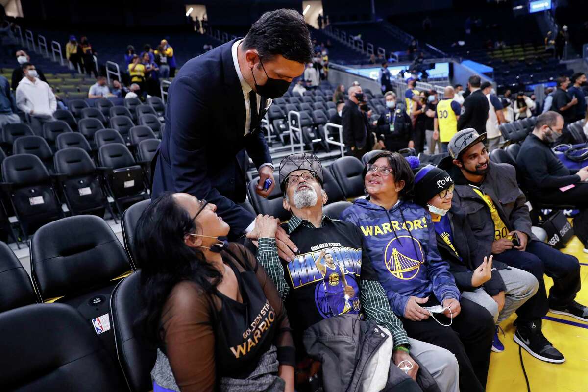 From left, Golden State Warriors' Zaza Pachulia spends time with Ashley Dias' sister, Vanessa, parents, Fabio and Gloria, niece, Angelique, 10, and brother, Trevor, before a game against the Memphis Grizzlies at Chase Center in San Francisco, Calif., on Thursday, October 28, 2021. Ashley Dias was the Lafayette crossing guard who was killed shoving students out of the way of an SUV last month.