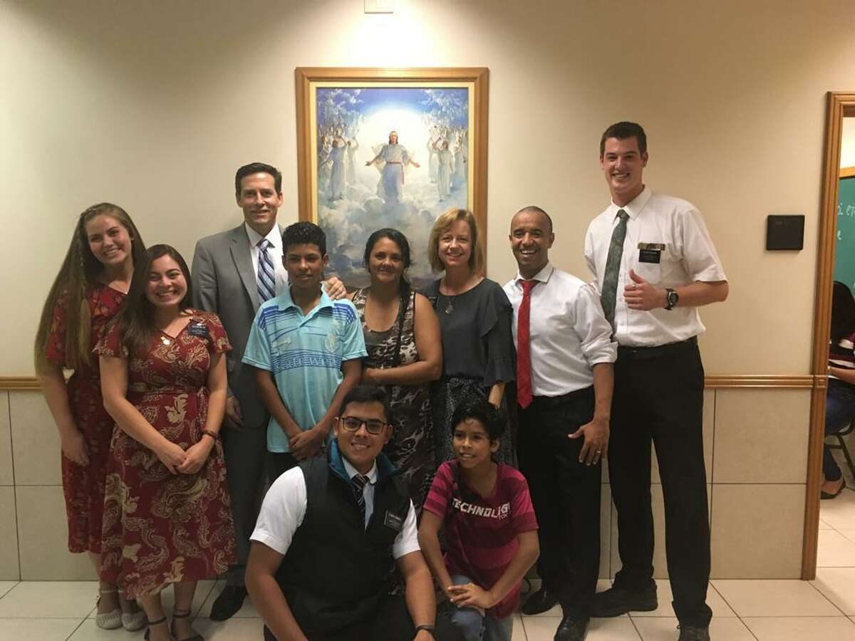 Tanner McKee (far right) poses in Paranagua, Brazil, with fellow missionaries, church officials and a local family. McKee spent 21 months in Brazil on his Mormon mission.