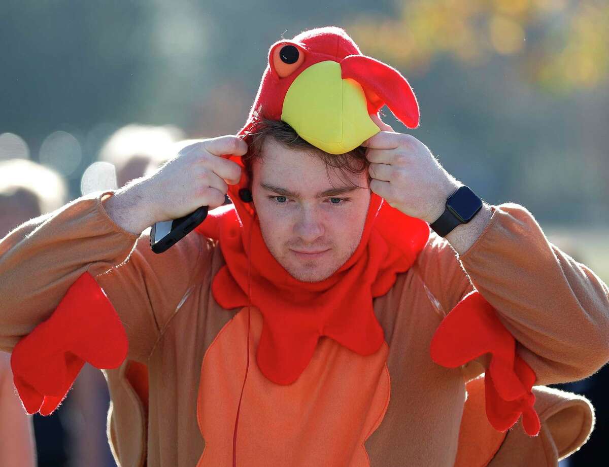 Hayden Lynch puts on a turkey costume during the city of Conroe’s Turkey Trot at Carl Barton Jr. Park, Saturday, Nov. 21, 2020, in Conroe. More than 200 runners took part in the annual 5K race. This year’s Turkey Trot is set for Nov. 20.