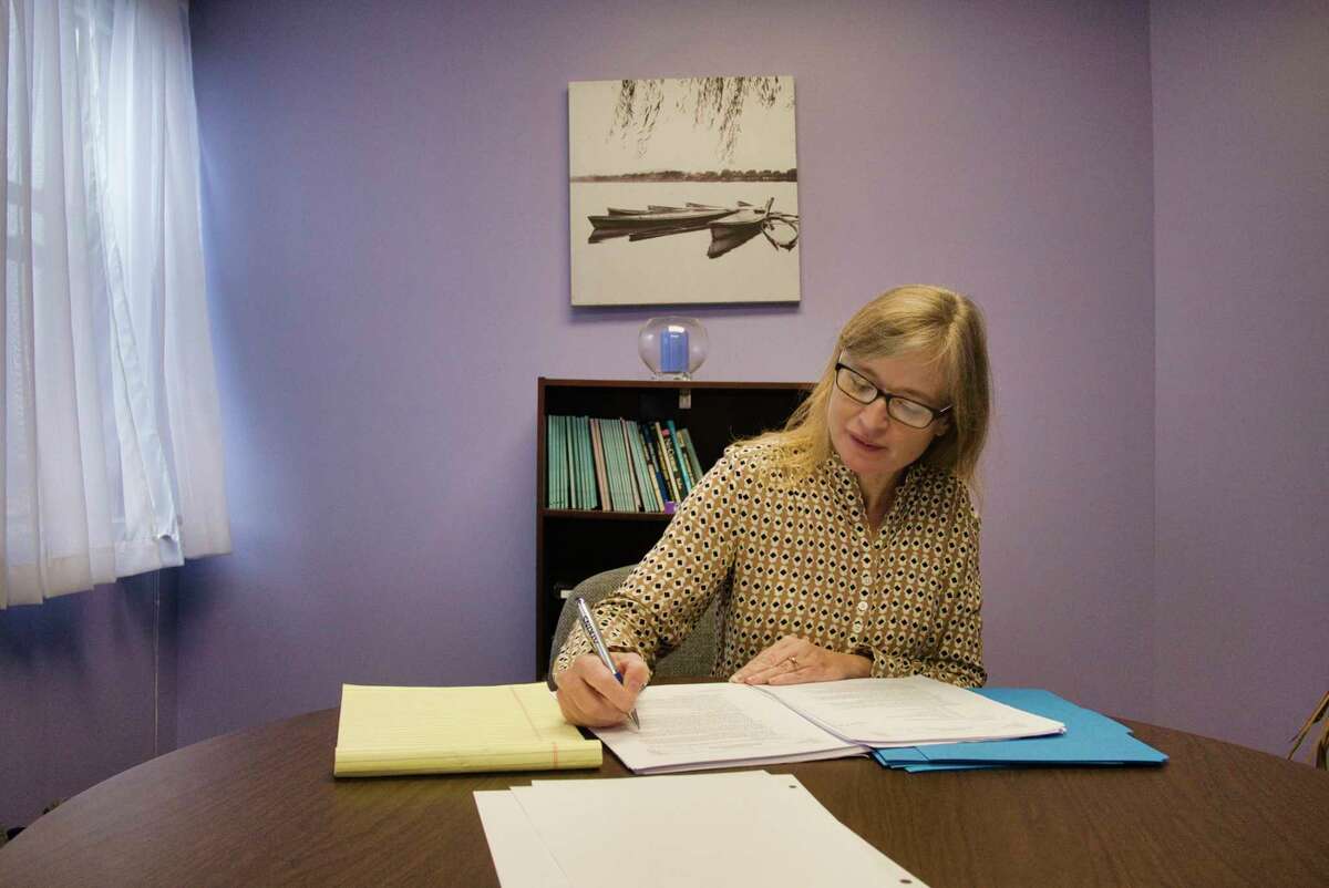 Sarah Rudgers-Tysz, executive director of Mediation Matters, works in one of the mediation rooms at the organization's office on Tuesday, Oct. 26, 2021, in Albany, N.Y.