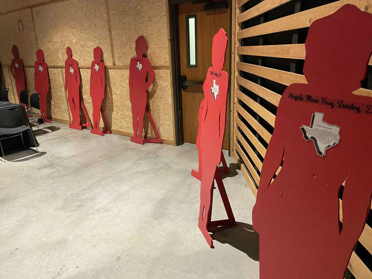 Silhouettes representing domestic violence homicide victims adorn the walls of Westland Baptist Church as part of the Silent Witness program on Thursday, Oct. 28, 2021, in Katy.