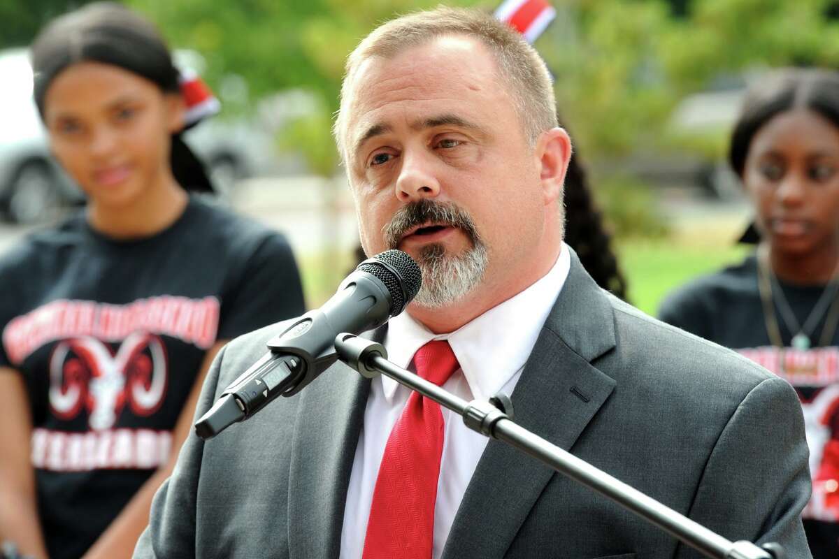 Board of Education Chairperson John Weldon, a Central High School graduate, speaks at the ribbon cutting ceremony for the newly renovated Central High School, in Bridgeport, Conn. Aug. 31, 2018.