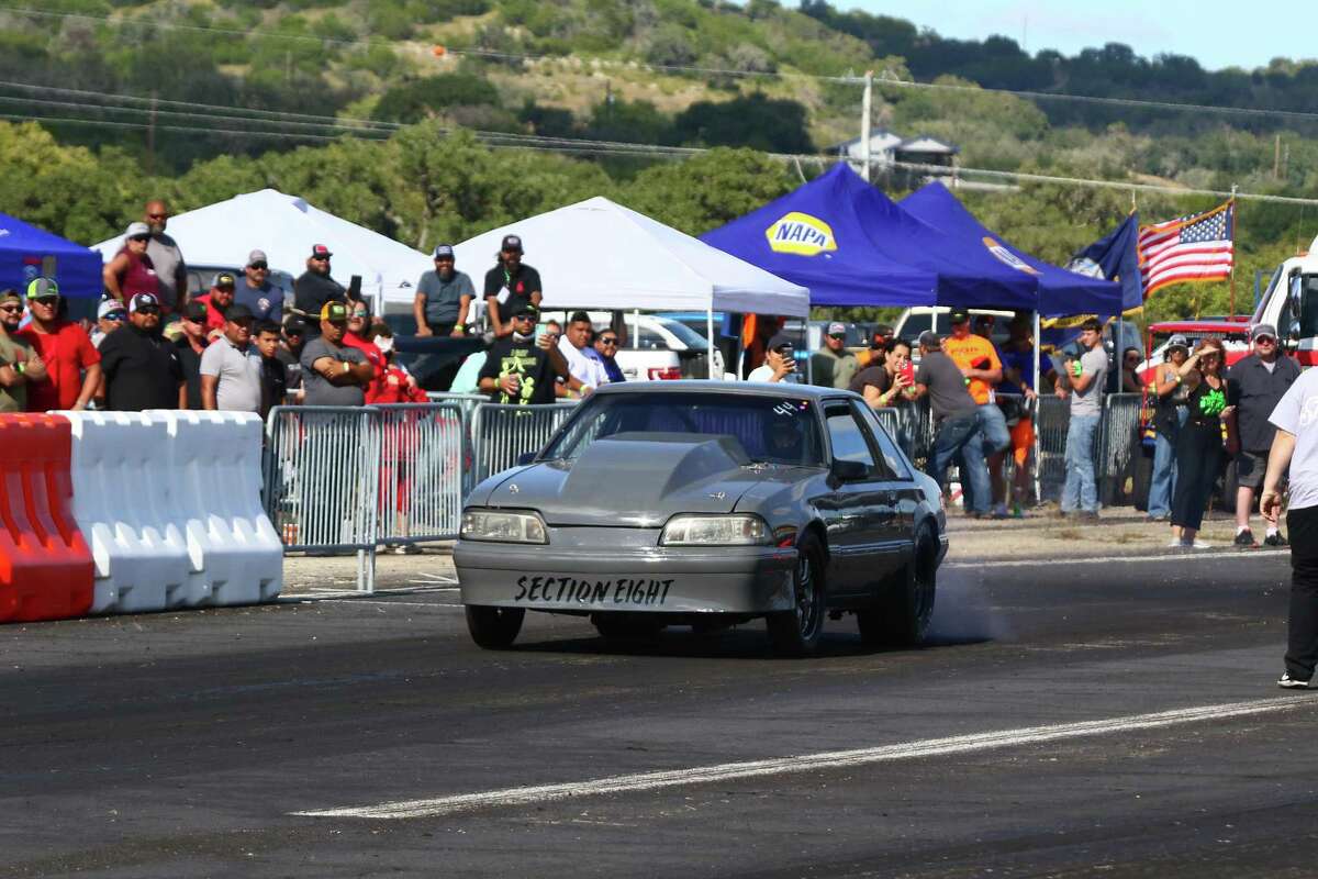 “Section Eight,” a 1990 Mustang, roars down the track before it loses control and slams into the crowd.