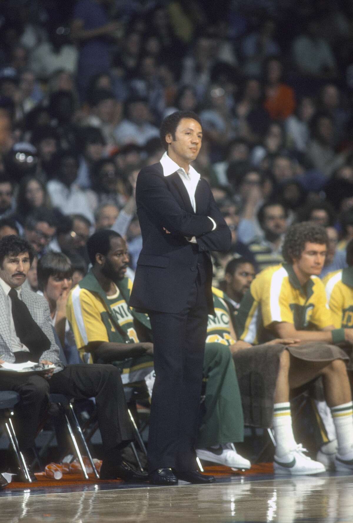 LANDOVER, MD - CIRCA 1978: Seattle Supersonics head coach Lenny Wilkens watches against the Washington Bullets during an NBA basketball game around 1978 at the Capital Center in Landover, Maryland.  Wilkens coached Supersonics from 1969-72 and 1977-85.  (Photo by Focus on Sport / Getty Images)