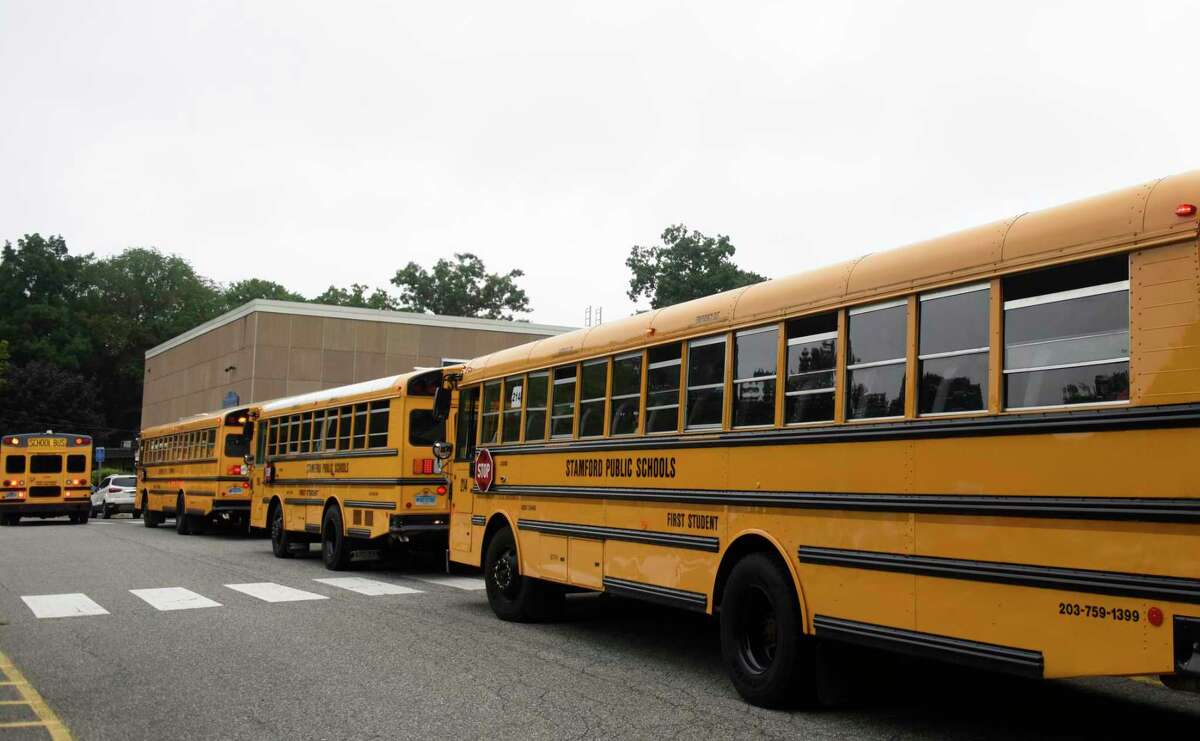 School buses lined up at Newfield Elementary School in Stamford, Conn. Monday, Aug. 30, 2021.