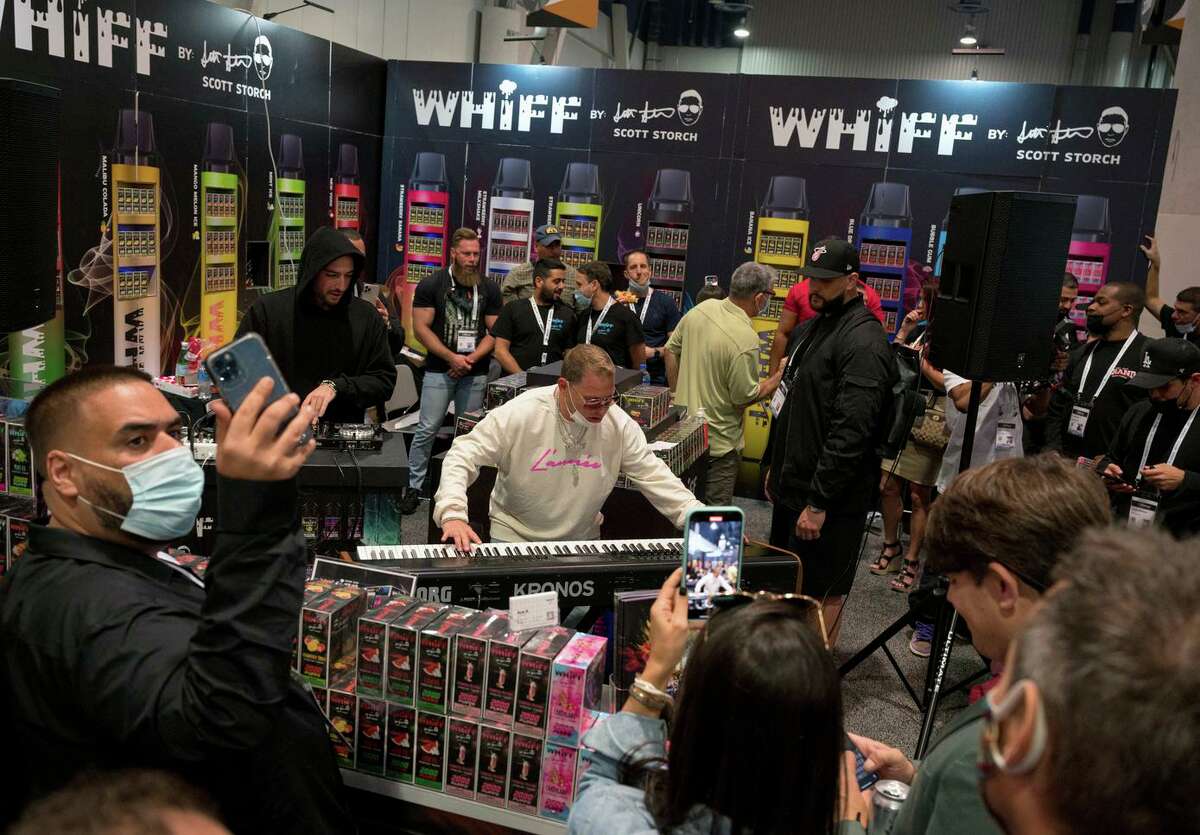 Producer Scott Storch plays keyboard at a booth for Whiff, his vape company, during MJBizCon at the Las Vegas Convention Center on Oct. 21