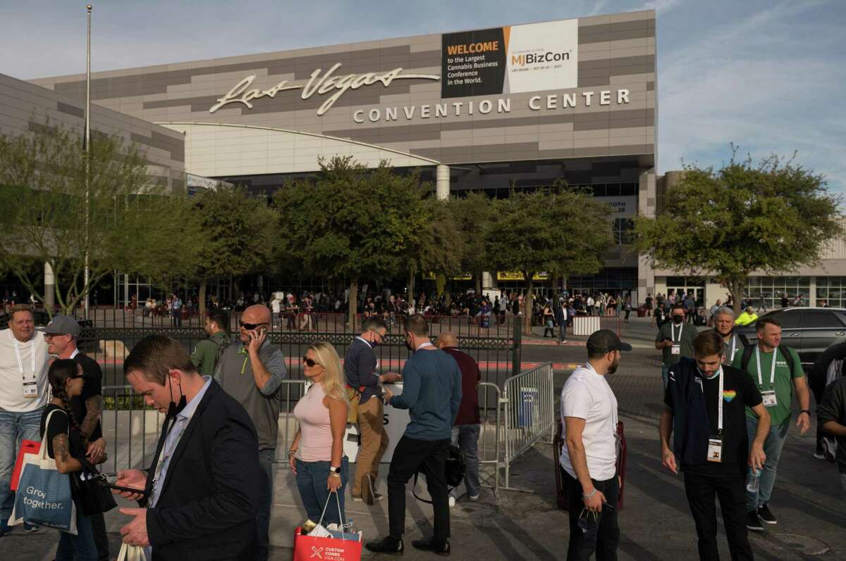 Attendees congregate outside the Las Vegas Convention Center during MJBizCon in Las Vegas.
