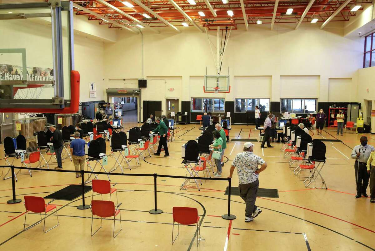 People vote on the last day of early-voting Friday, Oct. 29, 2021, at the West Gray Metropolitan Multi-Services Center in Houston.