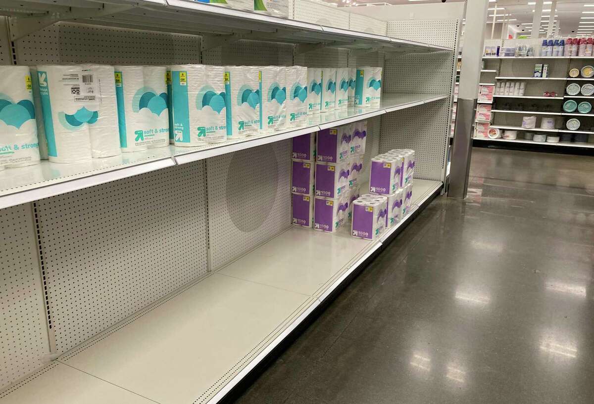 A small amount of packages of toilet paper sit on a display in a Target store late Tuesday, Oct. 19, 2021, in Glendale, Colo. Paper shortages are affecting consumers as well as business owners. Connecticut restaurants may soon have to increase their menu prices to accommodate for the shortages. (AP Photo/David Zalubowski)