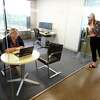 Chief Marketing Officer Diane Frankenfield, right, looks in on Senior Program Manager Alison Breward on Sept. 23, 2021 at the new iCapital offices at 2 Greenwich Plaza in Greenwich, Conn. The arrival of iCapital reflects the major demand for office space in downtown Greenwich.