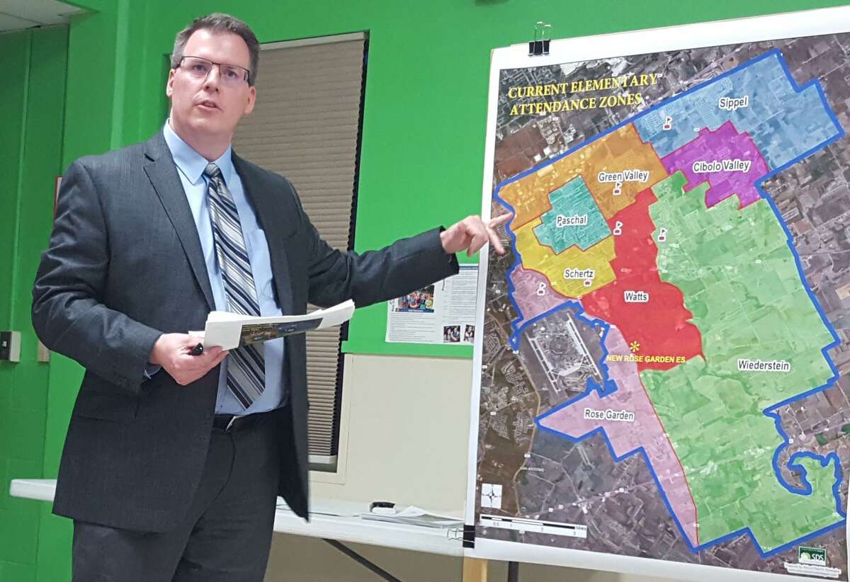 Brent Alexander, a demographer with School District Strategies in Dallas, reviews some of the Schertz-Cibolo-Universal City ISD elementary school attendance zone changes for 2018 in this file photo. The district’s board elections are Tuesday.