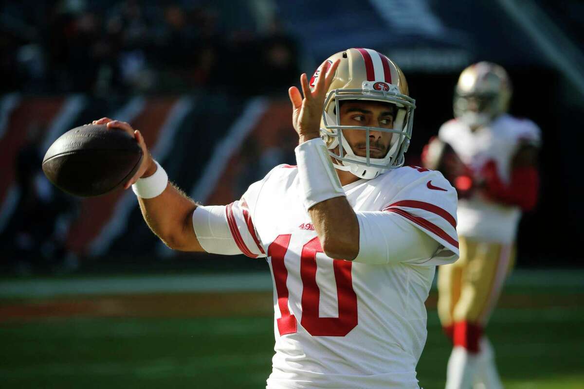 San Francisco 49ers quarterback Jimmy Garoppolo (10) warms up before an NFL football game against the Chicago Bears, Sunday, Dec. 3, 2017, in Chicago. (AP Photo/Charles Rex Arbogast)