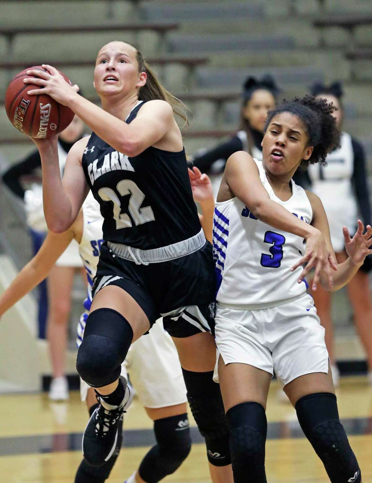 Hailey Adams breaks through a double team for the Cougars as South San plays Clark in first round girls basketball playoffs at Alamo Convocation Center on Feb. 18, 2020.