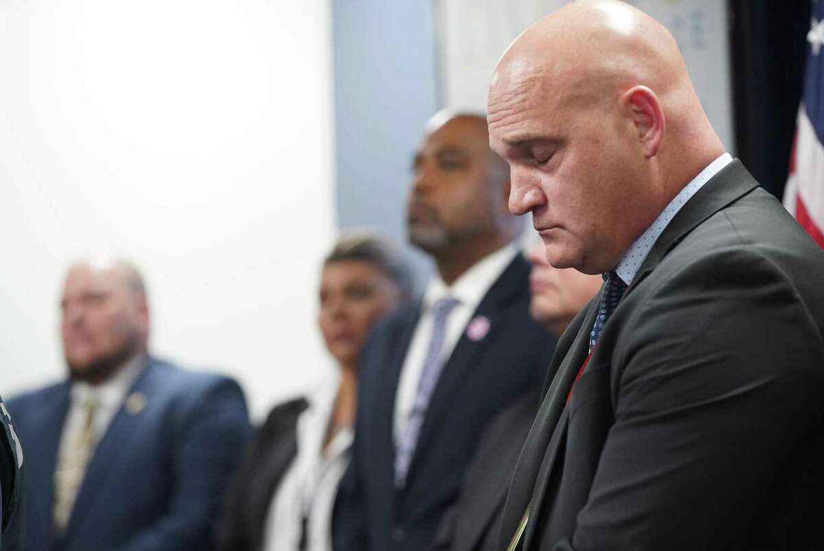 Harris County Sgt. Dennis Wolfford stands in line with other investigators as Sheriff Ed Gonzalez give an update about the children found abandoned in an apartment last week in Houston on Wednesday, Oct. 27, 2021.