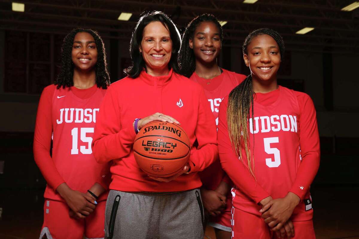 Judson girls basketball coach Christina Camacho, second from left, with players from left, Zaadiyah Stovall, Amira Mabry and Michaela Verrett, Wednesday, Oct. 27, 2021.