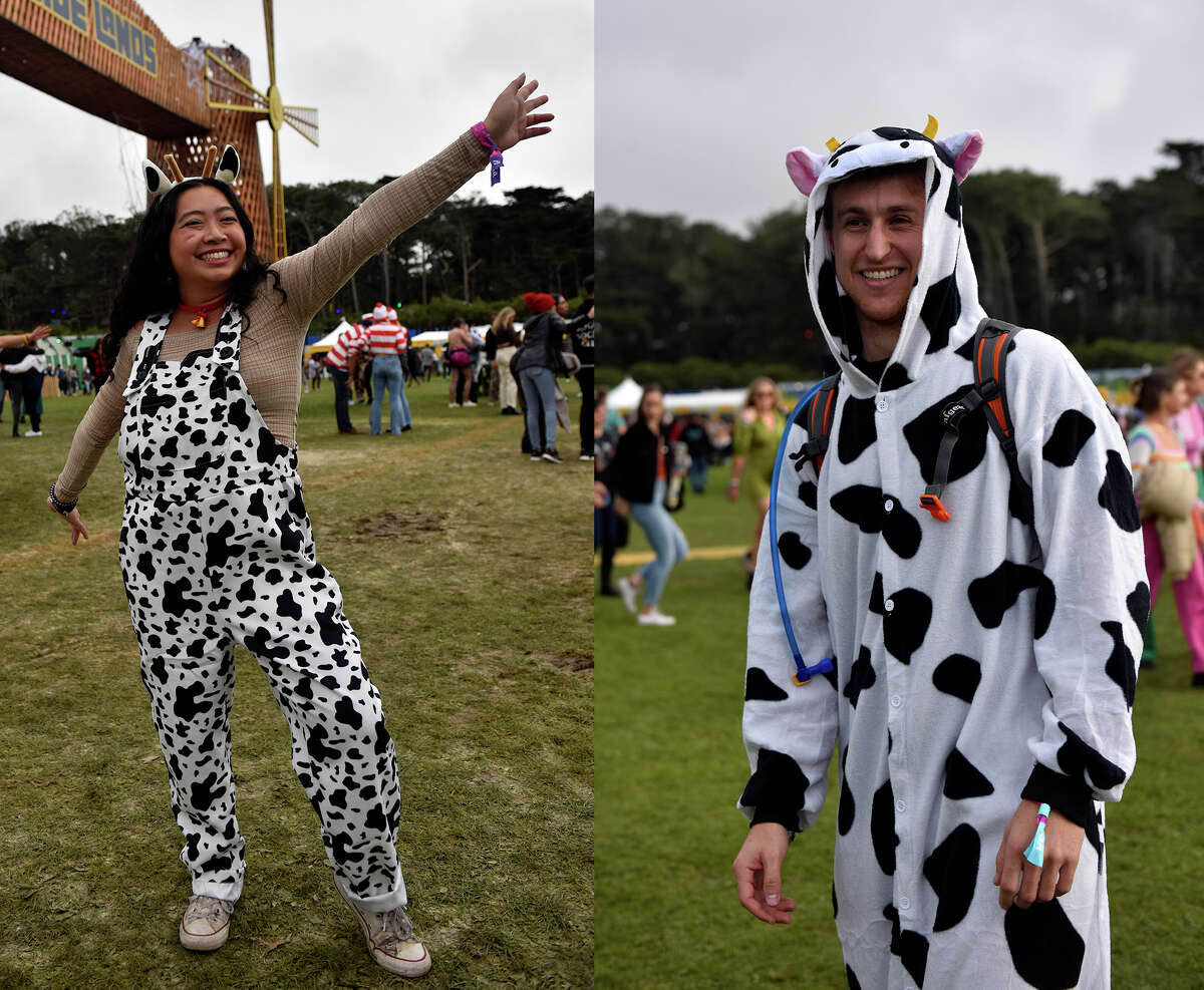 Nicole Woo (left)  of San Francisco shows off her cow print overalls at Outside Lands, on Saturday, Oct. 29, 2021, while Josh Rudolph of San Francisco sports a cow onesy near the Lands End stage at the festival.