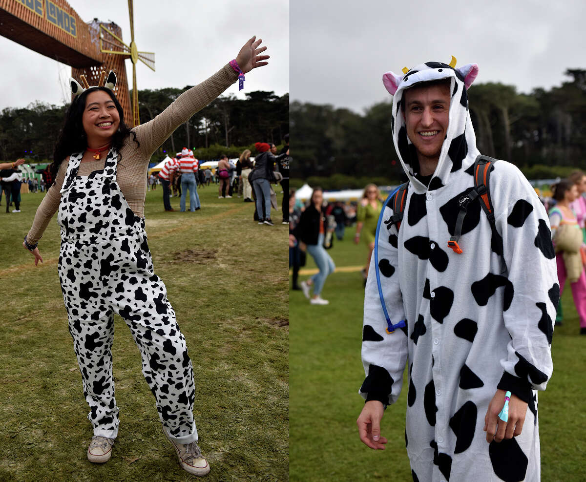 Nicole Woo (left) of San Francisco shows off her cow print overalls at Outside Lands, on Saturday, Oct. 29, 2021, while Josh Rudolph of San Francisco sports a cow onesy near the Lands End stage at the festival.