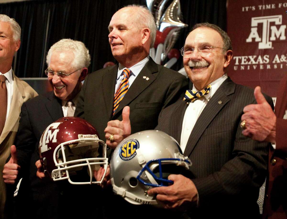 Southeastern Conference commissioner Mike Silve, left, the University of Florida president Bernie Machen, center, and Texas A&M president R. Bowen Loftin pose for a picture as Texas A&M officially enters the SEC, Monday, Sept. 26, 2011, in Kyle Field in College Station. ( Nick de la Torre / Houston Chronicle )