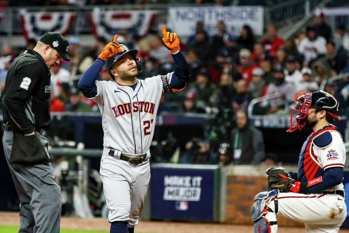 Houston Astros second baseman Jose Altuve (27) steps on home plate after hitting a solo home run to give the Astros a 2-0 lead during the fourth inning of Game 4 of the World Series on Saturday, Oct. 30, 2021 at Truist Park in Atlanta.