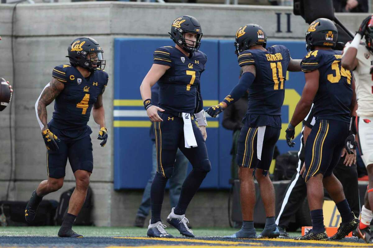 California quarterback Chase Garbers (7) celebrates with Kekoa Crawford (11) after scoring a touchdown against Oregon State during the first half of an NCAA college football game in Berkeley, Calif., Saturday, Oct. 30, 2021. (AP Photo/Jed Jacobsohn)