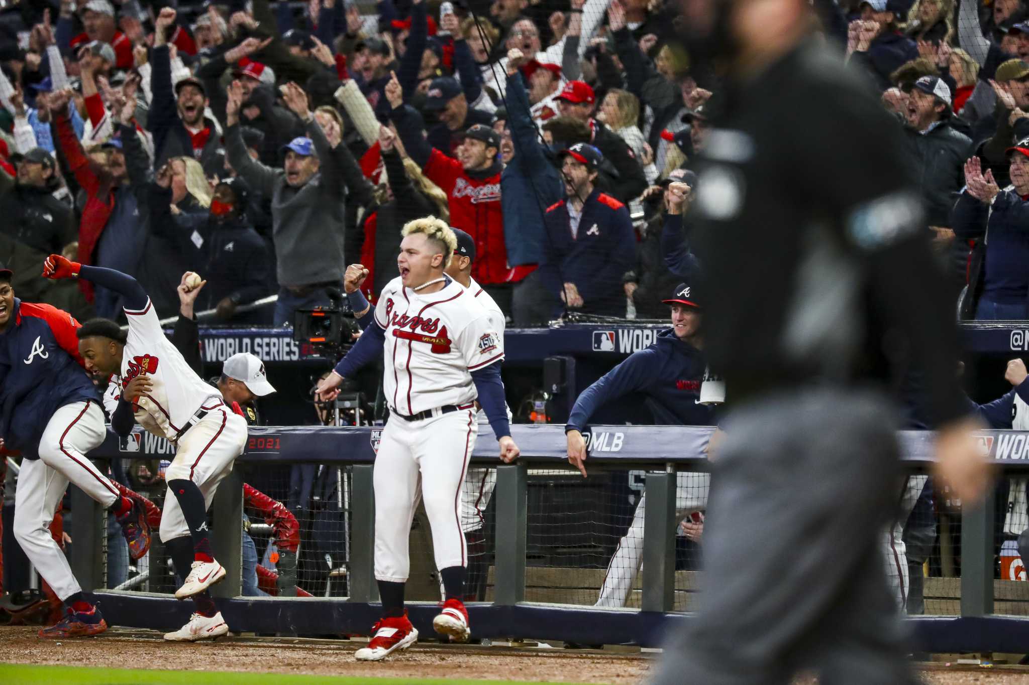 Austin Riley of the Atlanta Braves hits an RBI single in the sixth inning  of Game 4 of the World Series against the Houston Astros on Oct. 30, 2021,  at Truist Park