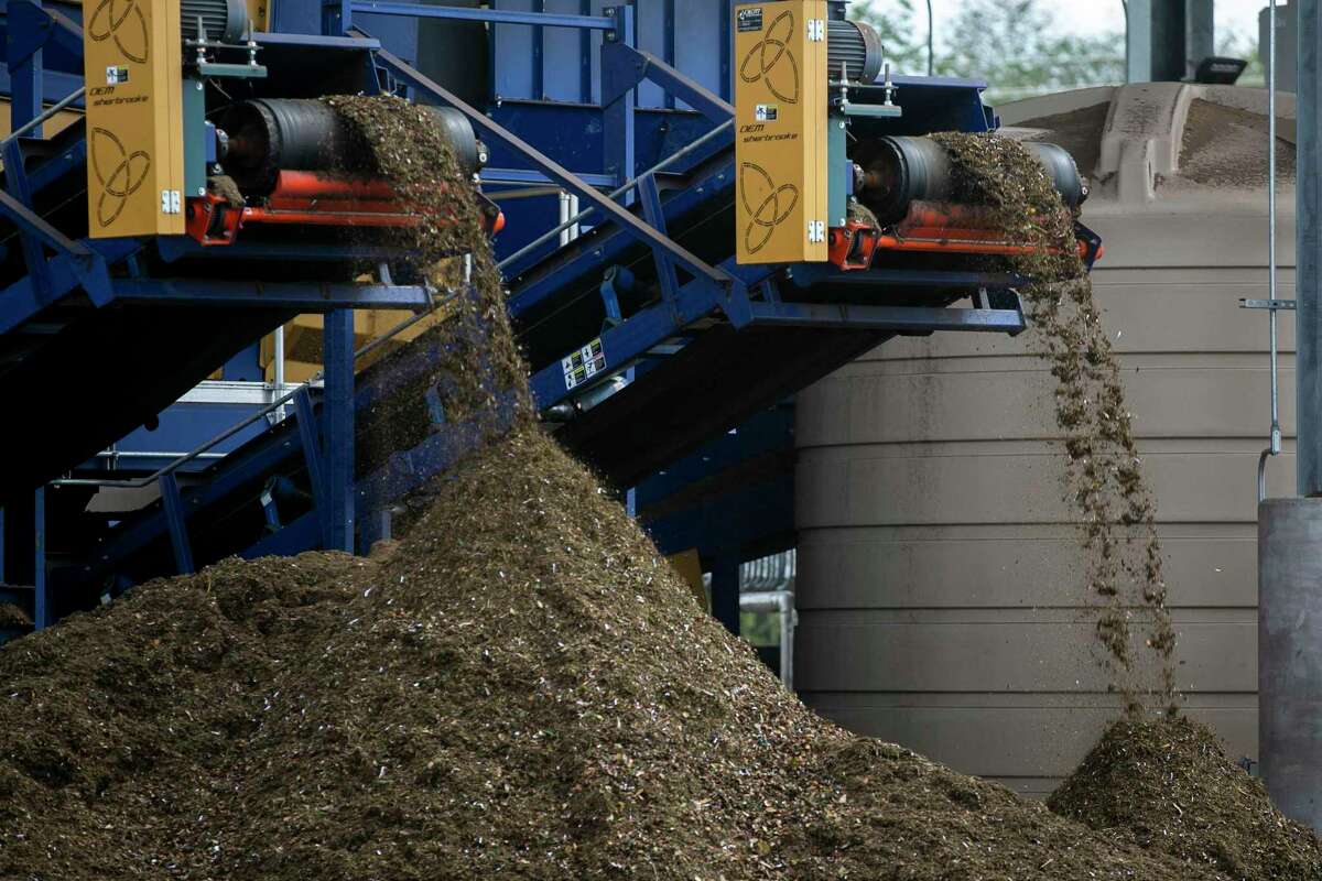 Material that has been processed forms piles at the end of the processing line at Atlas Organics in San Antonio, Texas, on Oct. 22, 2021.