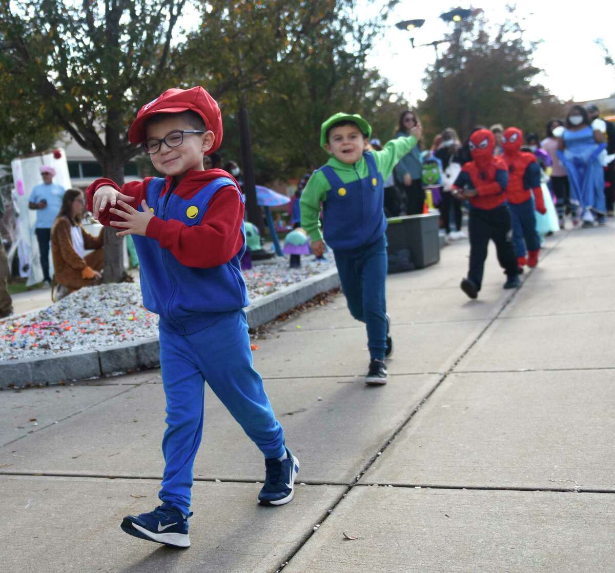 Stamford's Marco Fusaro, and his brother, Matteo Fusaro, both 6, are dressed as Mario and Luigi in the costume contest at the Tech or Treat Halloween event at J.M. Wright Technical High School in Stamford, Conn. Sunday, Oct. 31, 2021. The spooky event featured a kids costume contest, pumpkin painting, game stations, spooky vignettes made by students, a DJ, and 'Bone' Appétit cafe.