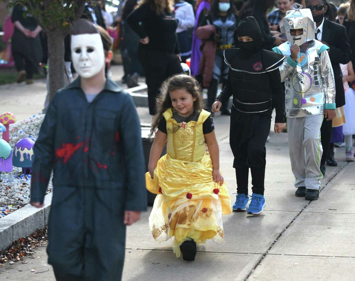 Photos from the Tech or Treat Halloween event at J.M. Wright Technical High School in Stamford, Conn. Sunday, Oct. 31, 2021. The spooky event featured a kids costume contest, pumpkin painting, game stations, spooky vignettes made by students, a DJ, and 'Bone' Appétit cafe.