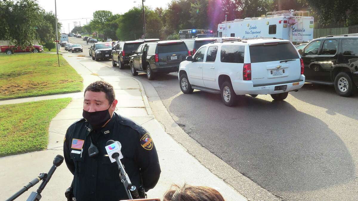 Laredo Police Department officers continue to wear masks for their safety as COVID-19 remains active in the area.