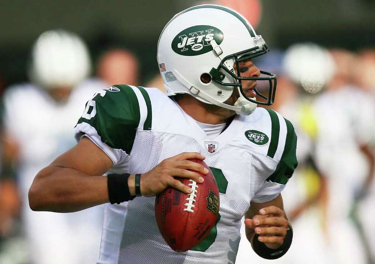 EAST RUTHERFORD, NJ - SEPTEMBER 19: Mark Sanchez #6 of the New York Jets drops back against the New England Patriots at the New Meadowlands Stadium on September 19, 2010 in East Rutherford, New Jersey. (Photo by Andrew Burton/Getty Images) *** Local Caption *** Mark Sanchez