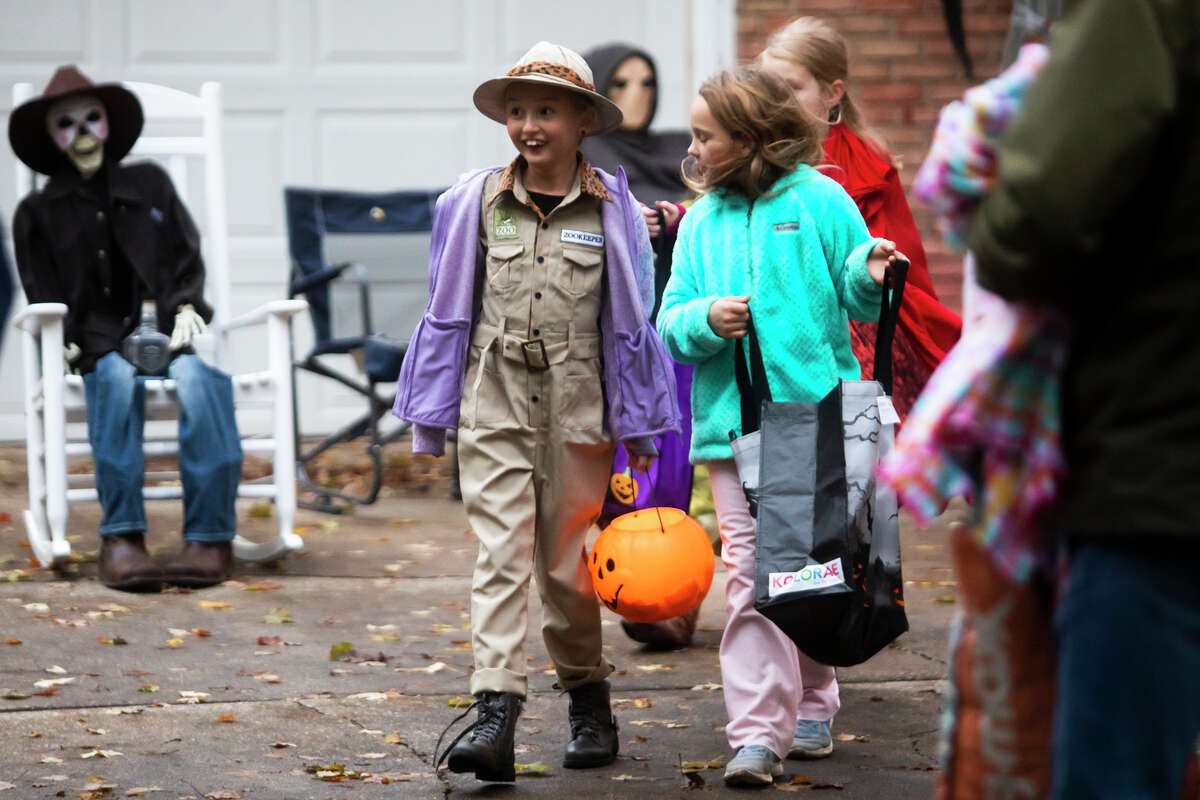 Families go trick-or-treating Sunday, Oct. 31, 2021 in Midland. (Katy Kildee/kkildee@mdn.net)