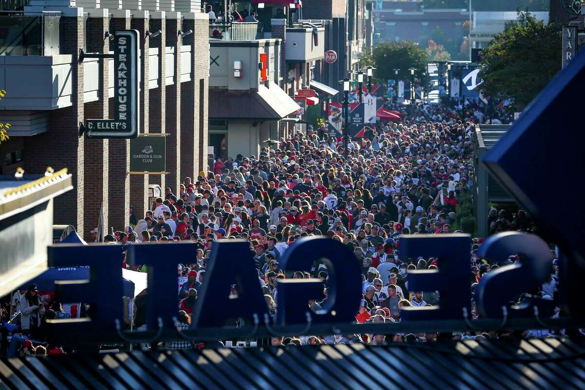 Fans fill the street outside of the ball park before Game 5 of the World Series on Sunday, Oct. 31, 2021 at Truist Park in Atlanta.