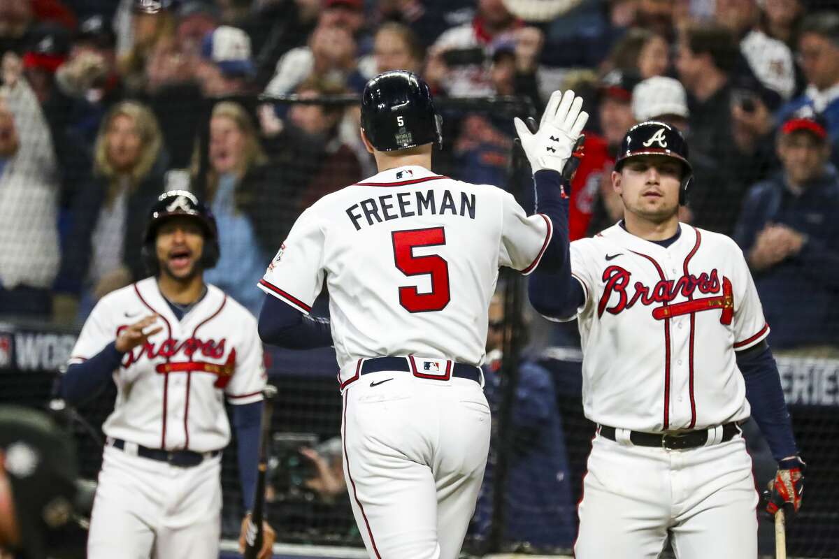Atlanta Braves first baseman Freddie Freeman celebrates after hitting a solo home run to give the Braves a 5-4 lead during the third inning of Game 5 but the advantage didn't last long.