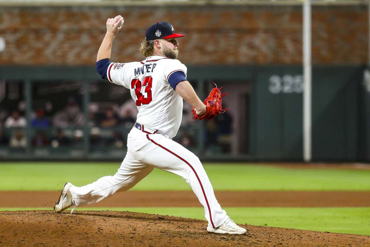 Atlanta Braves relief pitcher A.J. Minter (33) pitches during the fourth inning of Game 5 of the World Series on Sunday, Oct. 31, 2021 at Truist Park in Atlanta.