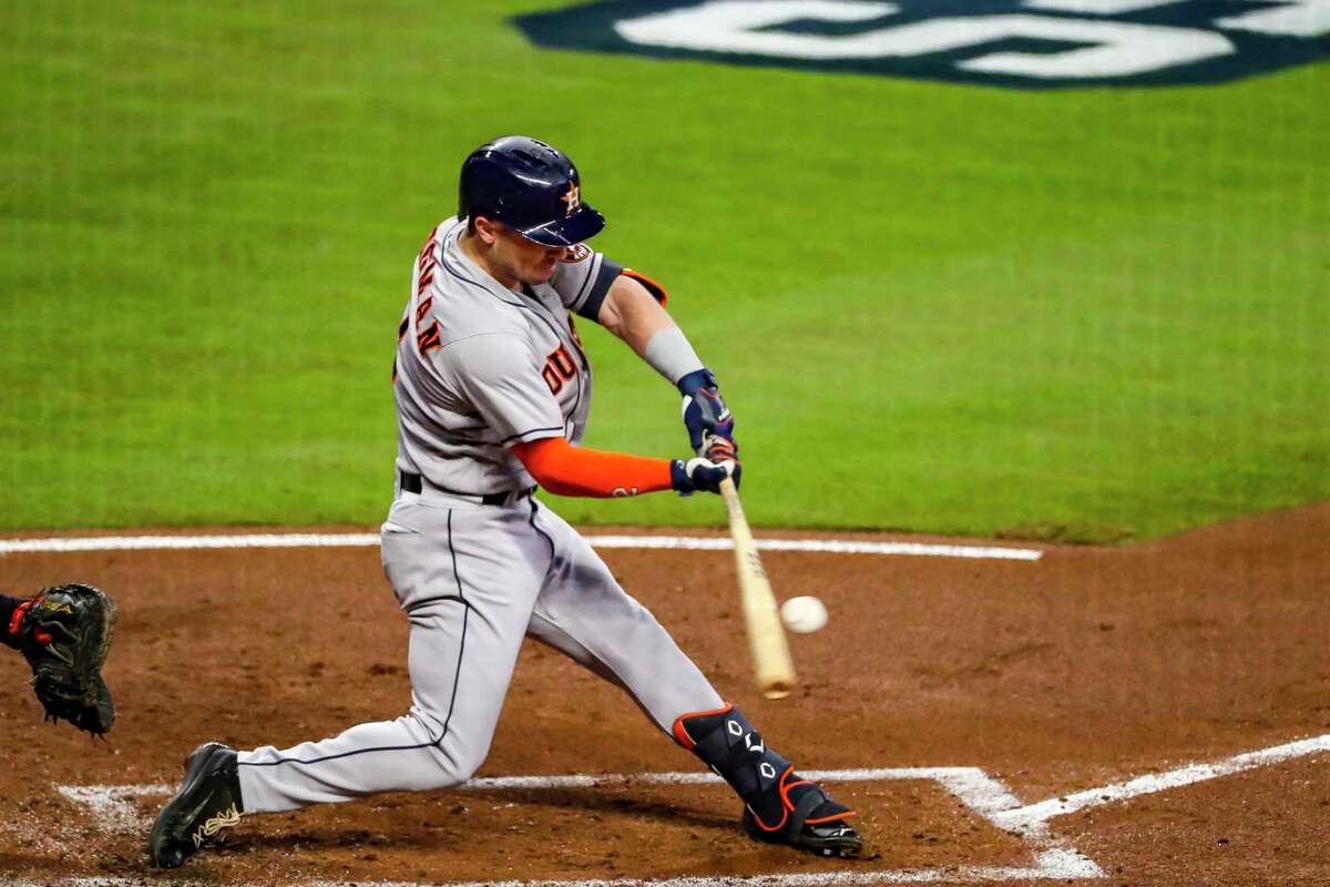 Houston Astros third baseman Alex Bregman (2) hits an RBI double to deep right center to score Houston Astros first baseman Yuli Gurriel (10) during the second inning of Game 5 of the World Series on Sunday, Oct. 31, 2021 at Truist Park in Atlanta.