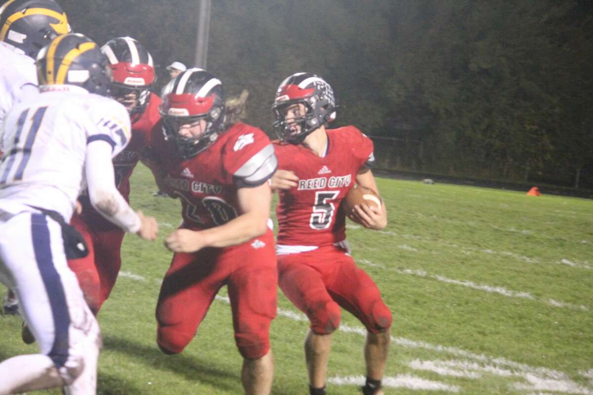 Nick Wirgau (5) of Reed City looks for running room against Manistee