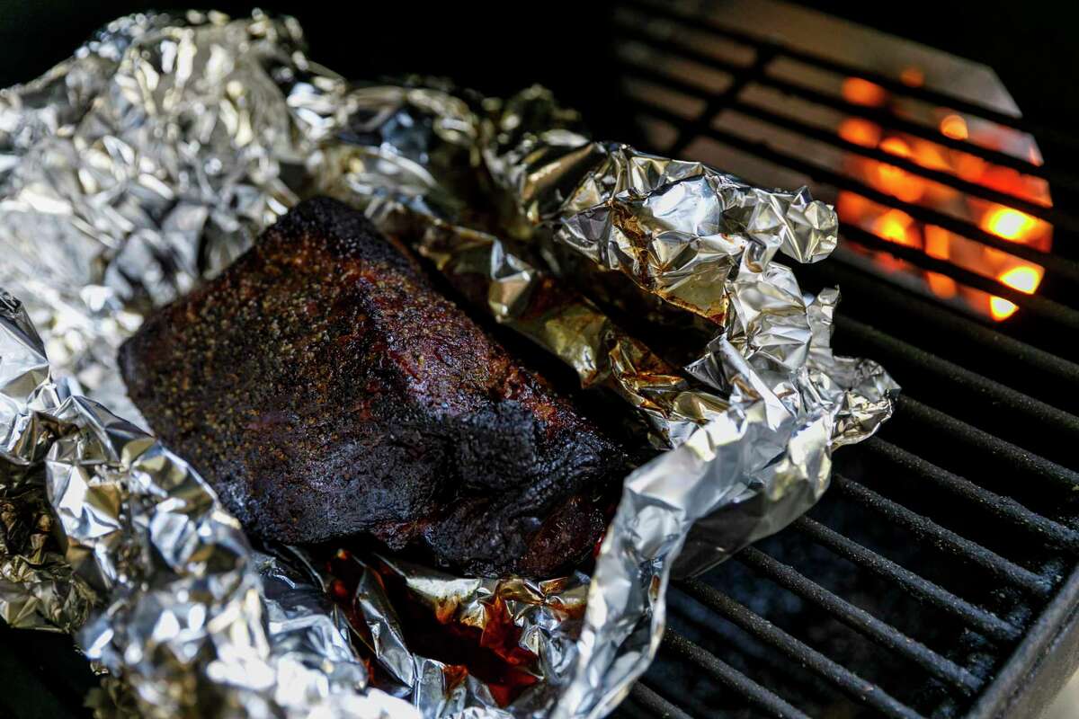 Chuck Blount cooks brisket fast and hot using a firebox smoker at Chuck's Food Shack.
