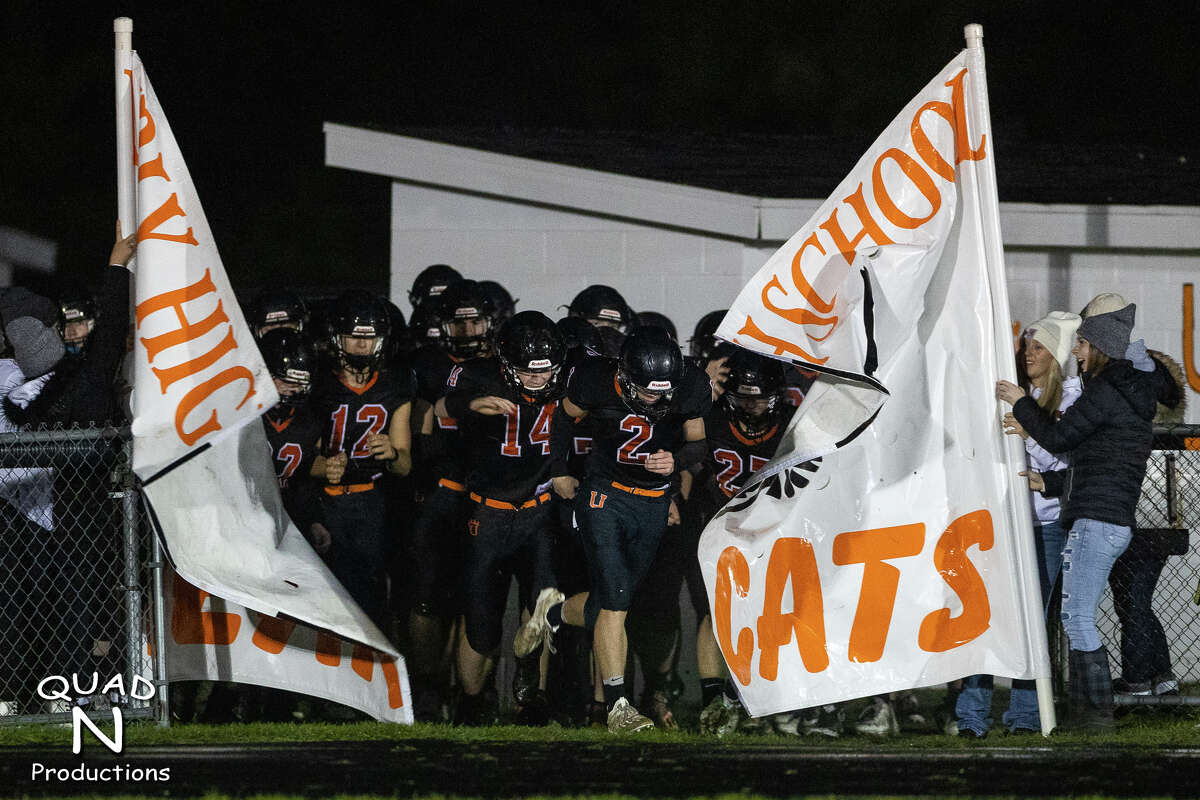 The Ubly Bearcats run out of the tunnel.