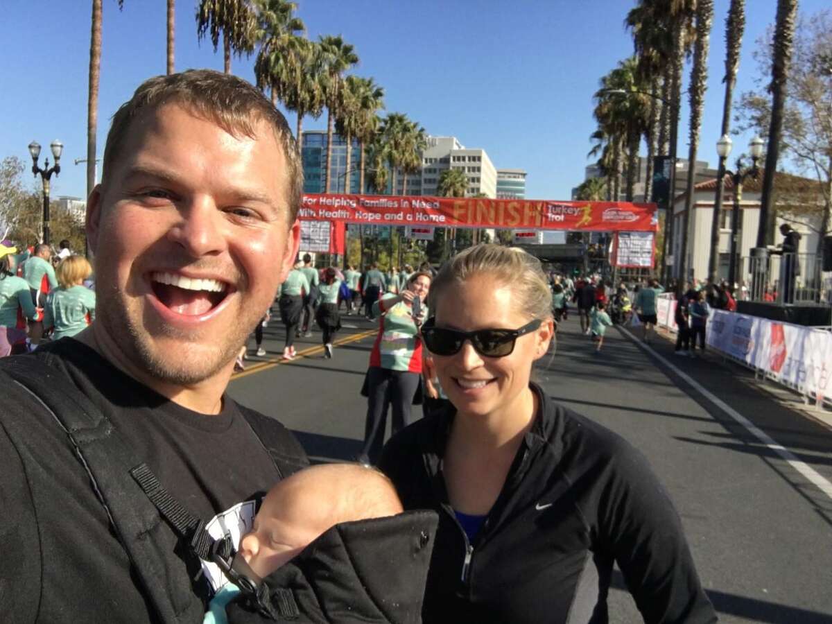 Milford resident Tor Blackstad with his son, Jaxin, and wife, Jaime, at the 2016 Turkey Trot in San Jose, Calif., just before the finish. Blackstad has started the Milford Turkey Trot this Thanksgiving Day.