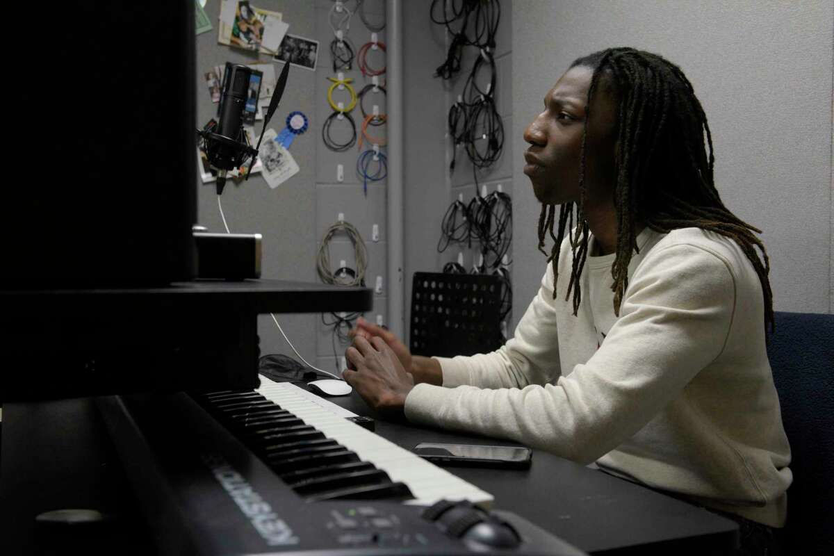 Bethel High School senior Ethan Smith works in a studio at the high school,Wednesday morning, October 28. Smith went viral on TikTok after he stepped up to play the piano for a classmate whose music track went off mid-performance. Recently, Smith  won a prestigious Musical Theater Songwriting Challenge with his song is titled “Some People Just Die”. 