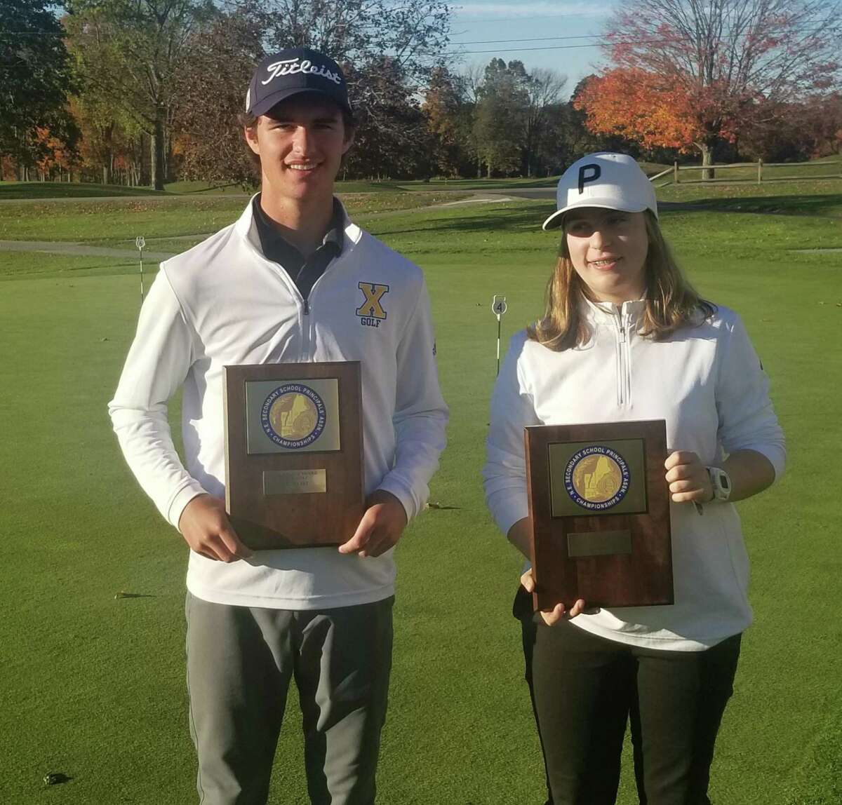 Joey Lenane, left, and Lillian Gulleserian, both from Massachusetts, were the New England golf champions in the meet held at the Mohegan Sun Golf Club in Baltic on Monday.