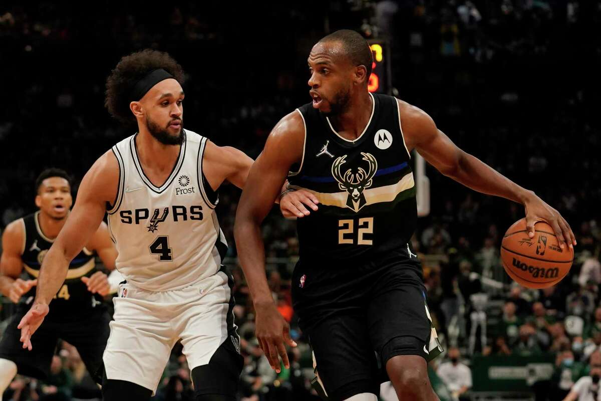 Spurs guard Derrick White guards Khris Middleton on Saturday. The Spurs held the Bucks to season-low 93 points in their win.
