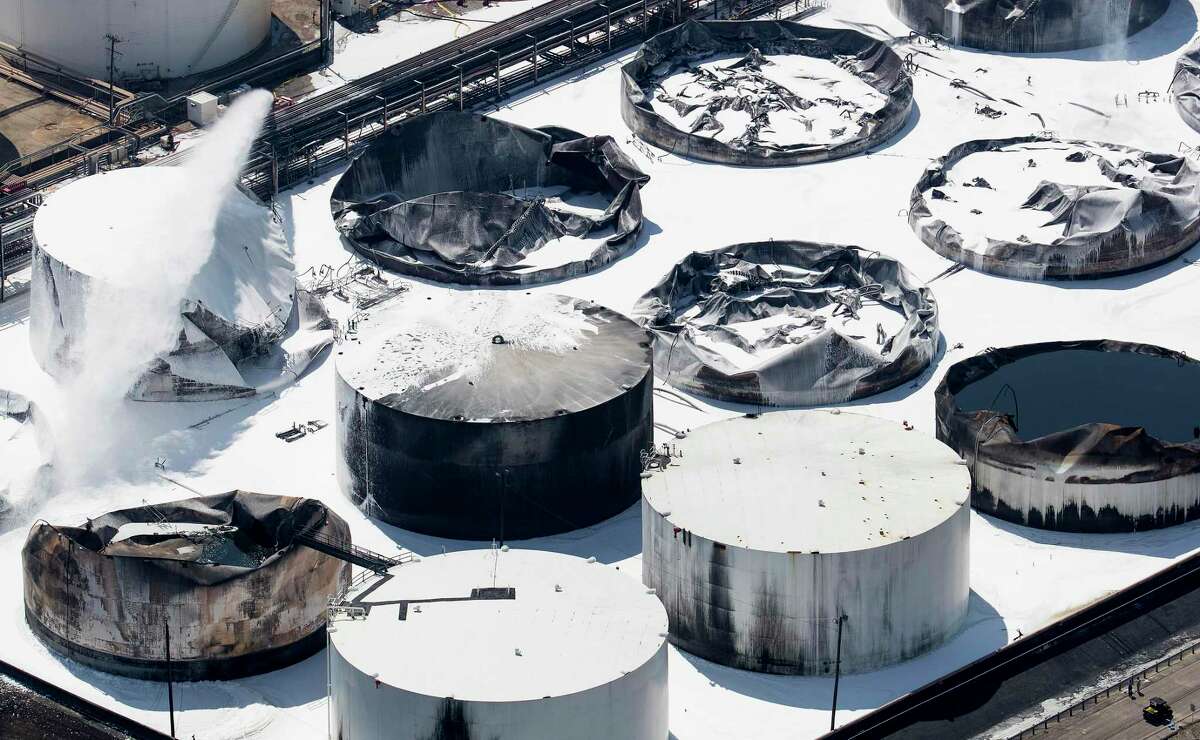 Emergency crews continued to douse what was left of the extinguished petrochemical tank fire at Intercontinental Terminals Company on Wednesday, March 20, 2019, in Deer Park.