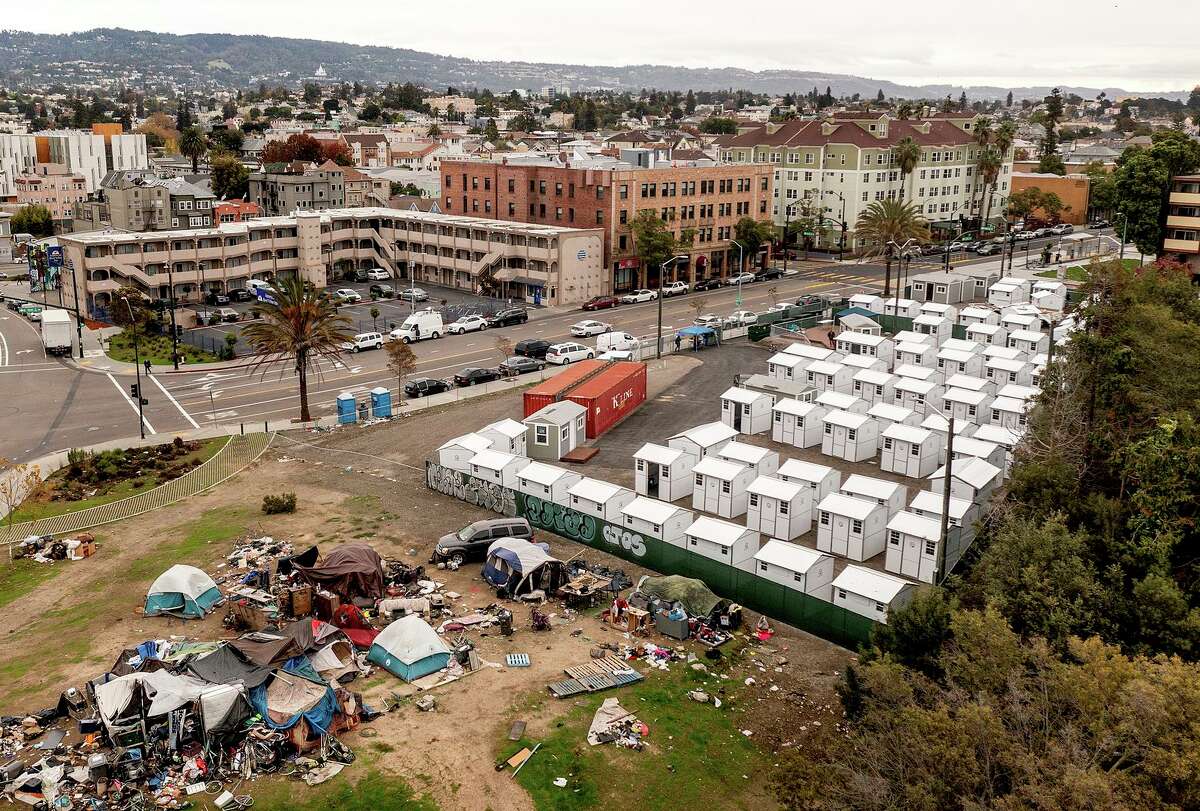 Tiny homes line Lakeview Village, a site to shelter the homeless and help reduce encampments in Oakland.