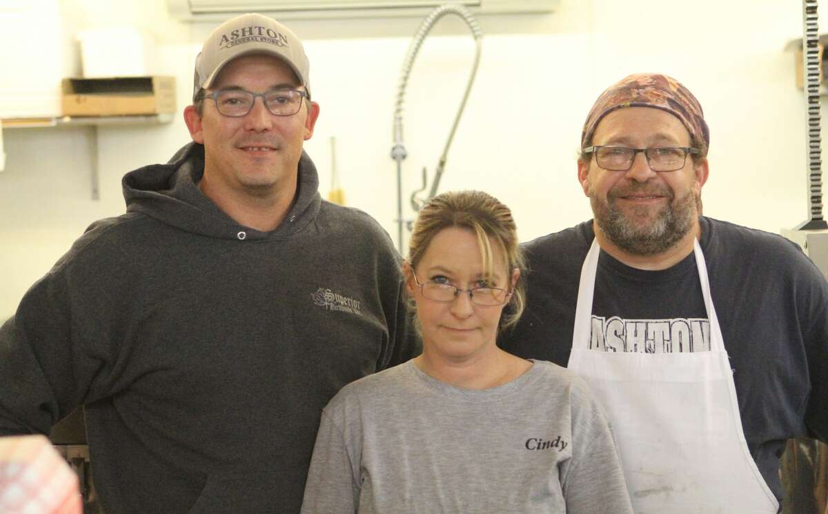 From left-to-right: Jeremy Kage, Cindy Cox and Chris White stand behind the deli counter at Ashton General Store on a weekday afternoon.