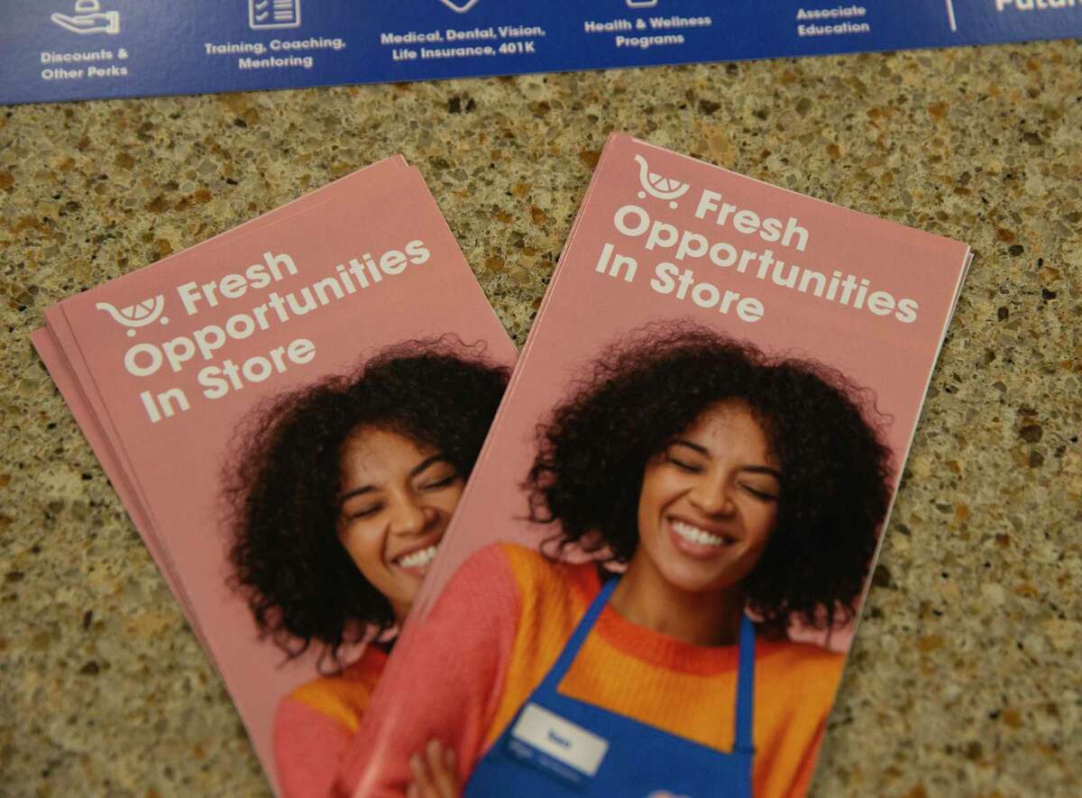 Kroger's hiring pamphlets are photographed at a hiring event Wednesday, Oct. 13, 2021, in Houston. The grocery store chain was hosting hiring events in all of its Houston stores as it looks to immediately hire 500 people.